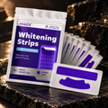 Sachet KHAZIX Whitening Strips violet et blanc, mise en scène premium sur pierre sombre